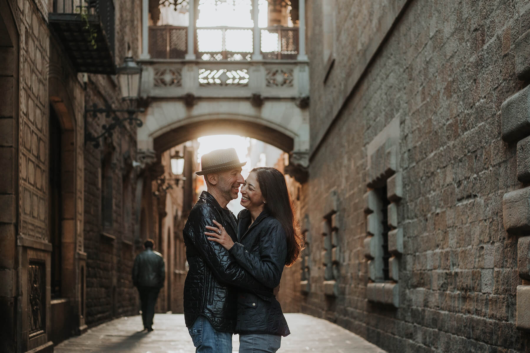 couple hugging each other and laughing in Born district in Barcelona, Spain