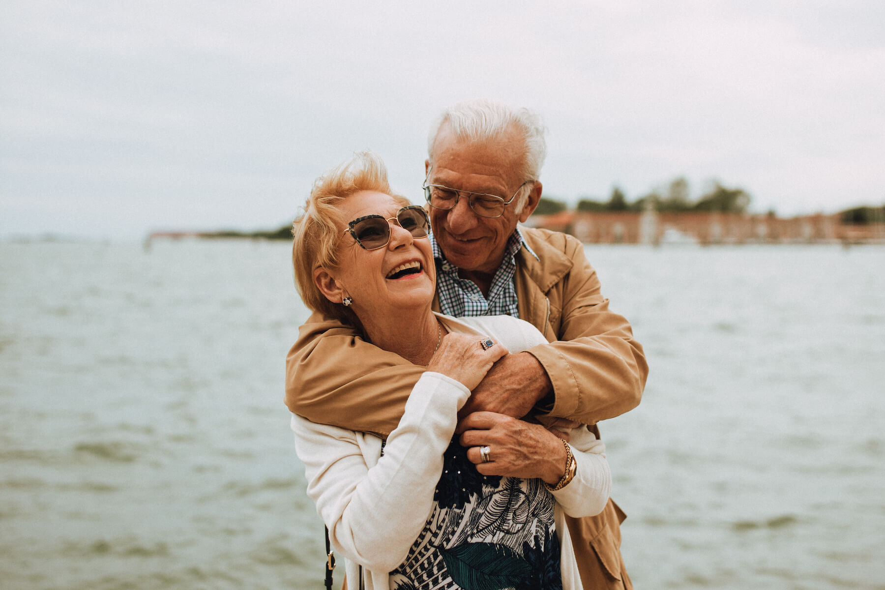 older couple hugging each other in Venice, Italy