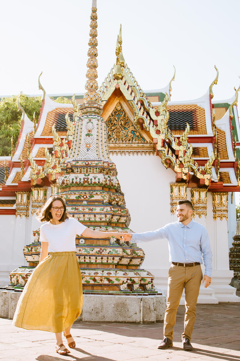 couple holding hands and walking in Bangkok, Thailand