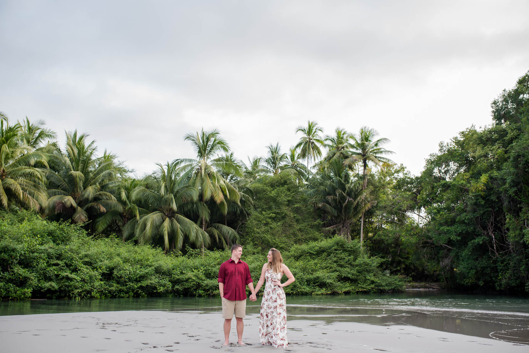 couple standing on the beach in Manuel Antonio, Costa Rica