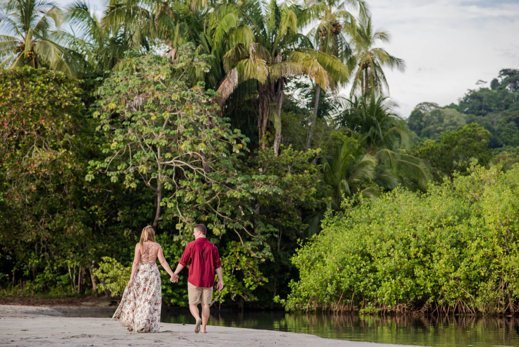 couple walking down the beach in Manuel Antonio, Costa Rica