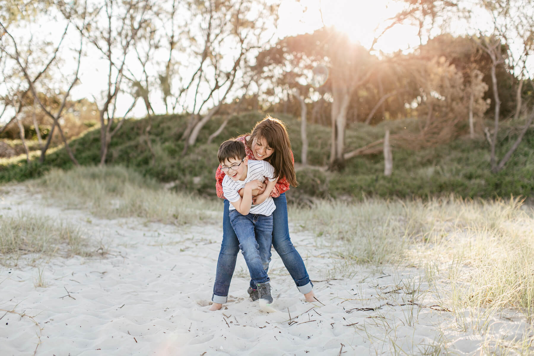 Couple on the beach with kid in Byron Bay