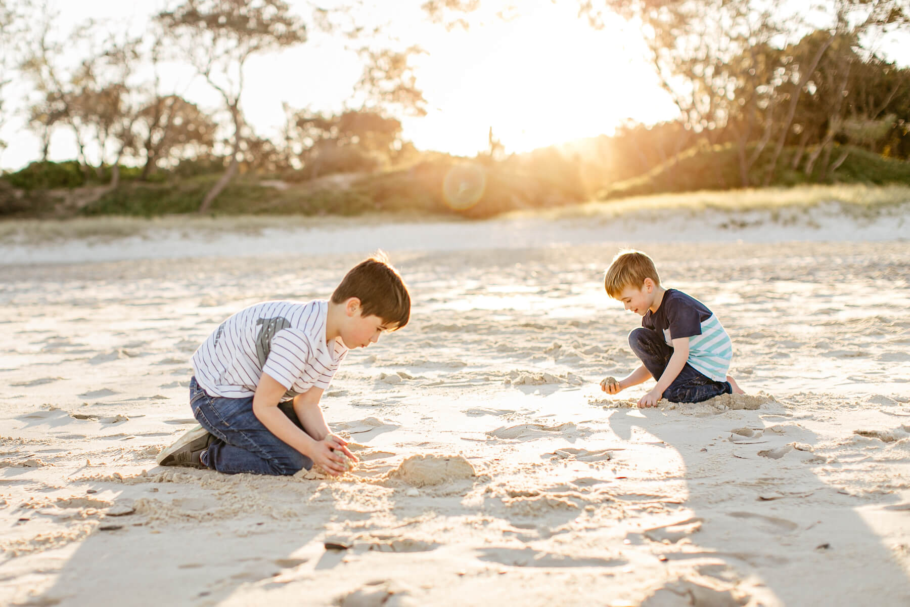 Couple on the beach with kid in Byron Bay