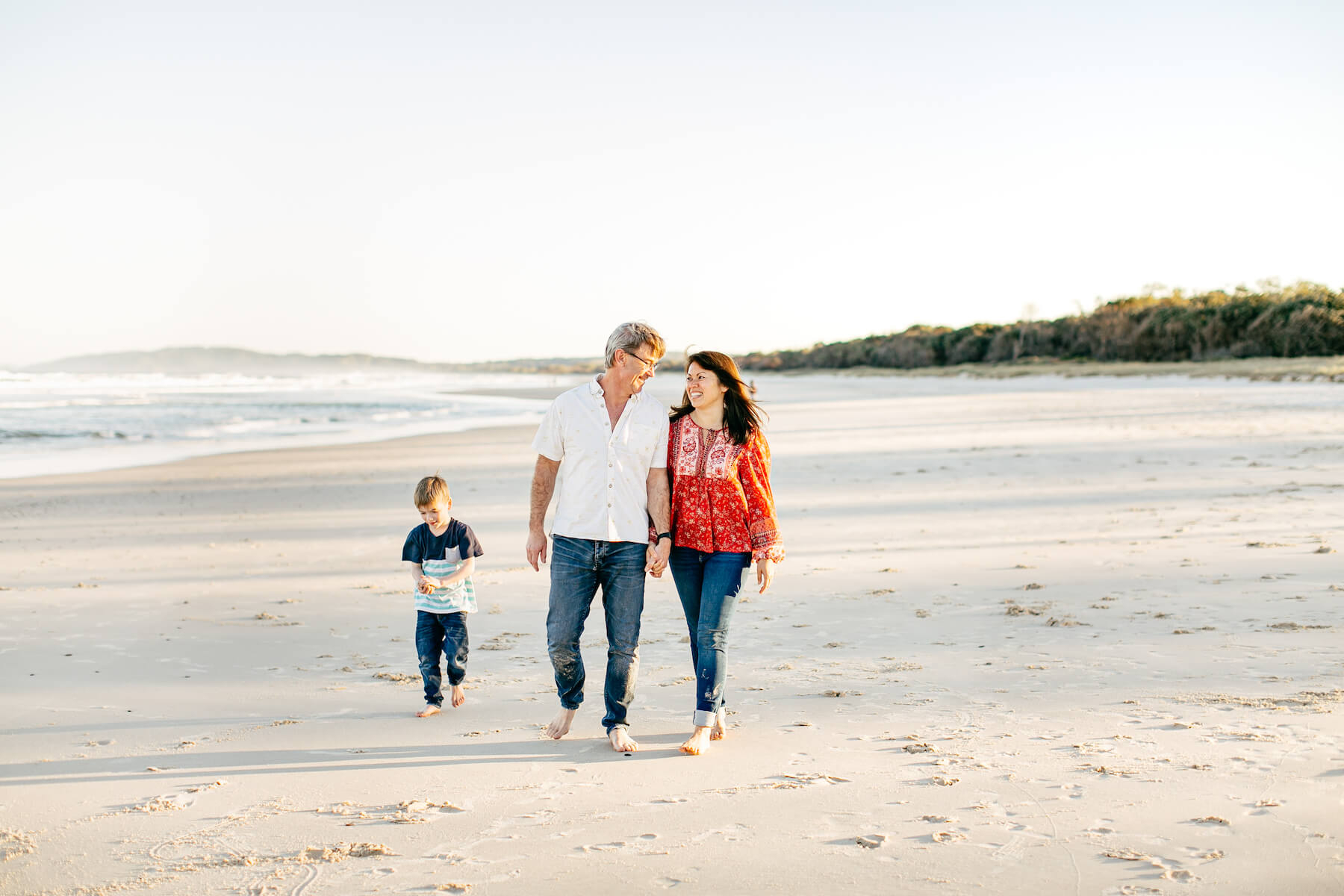 Couple on the beach with kid in Byron Bay