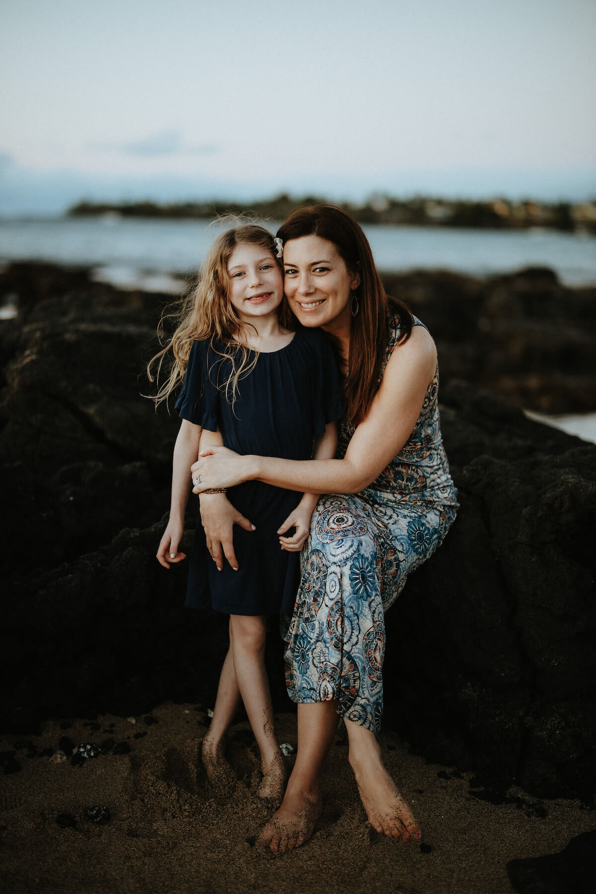 Mother and daughter on beach in Kona Hawaii USA