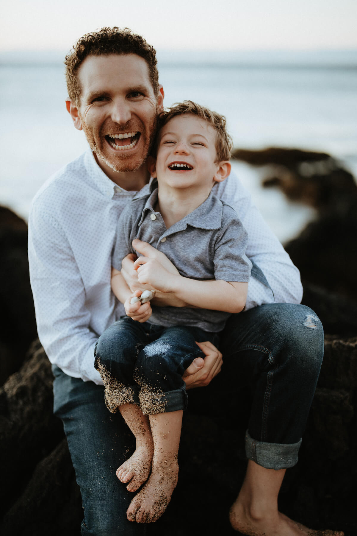 Father and son on beach in Kona Hawaii USA