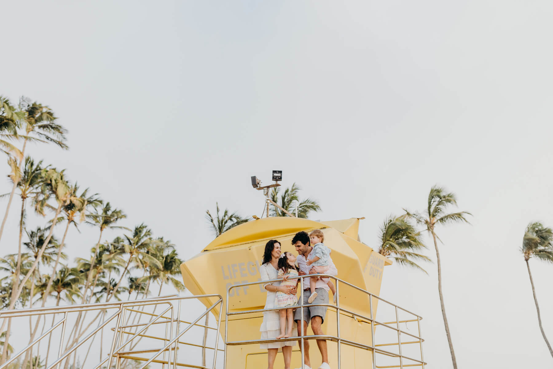 Family on lifeguard stand in Maui Hawaii USA 