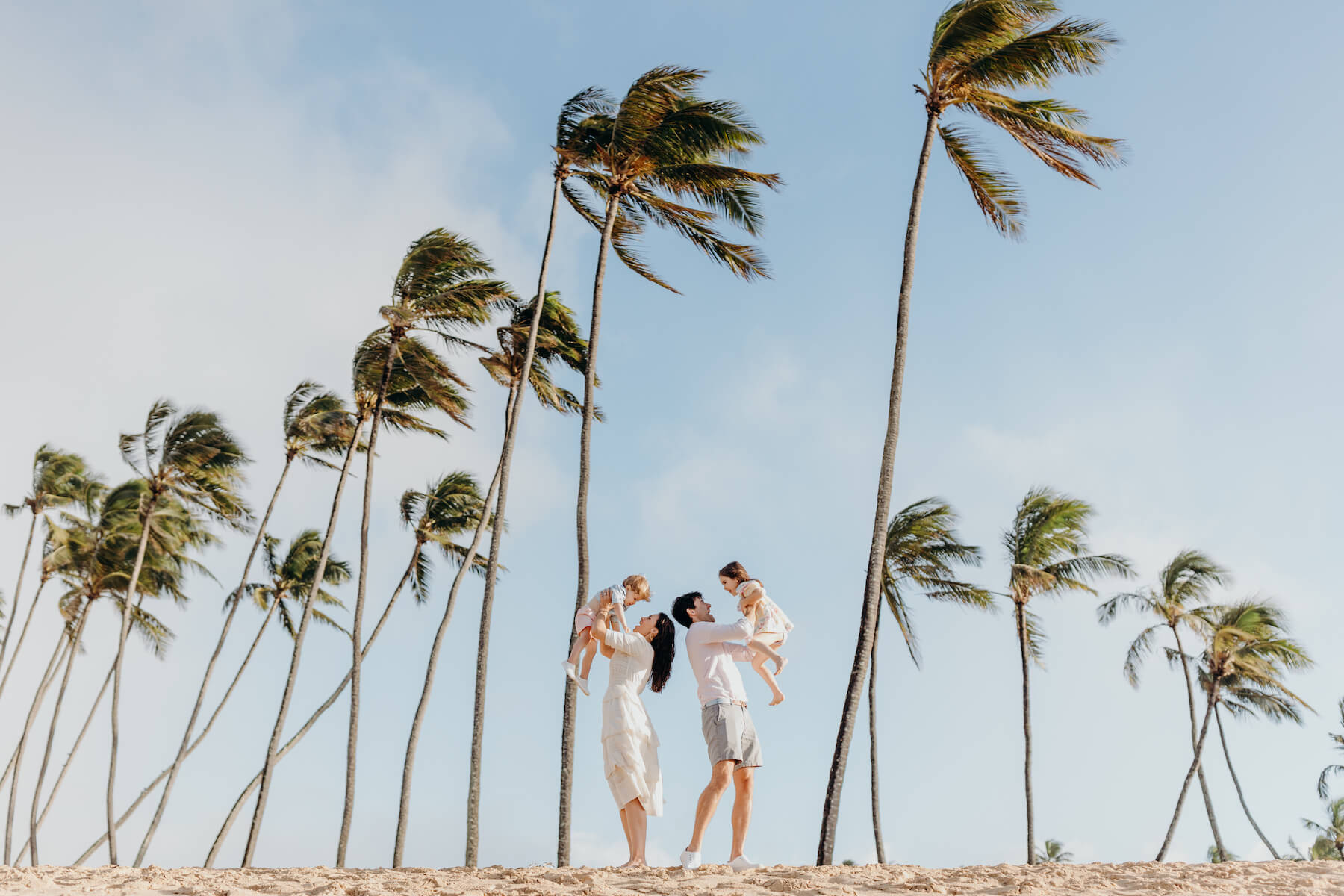 Family with palm trees in Maui Hawaii USA