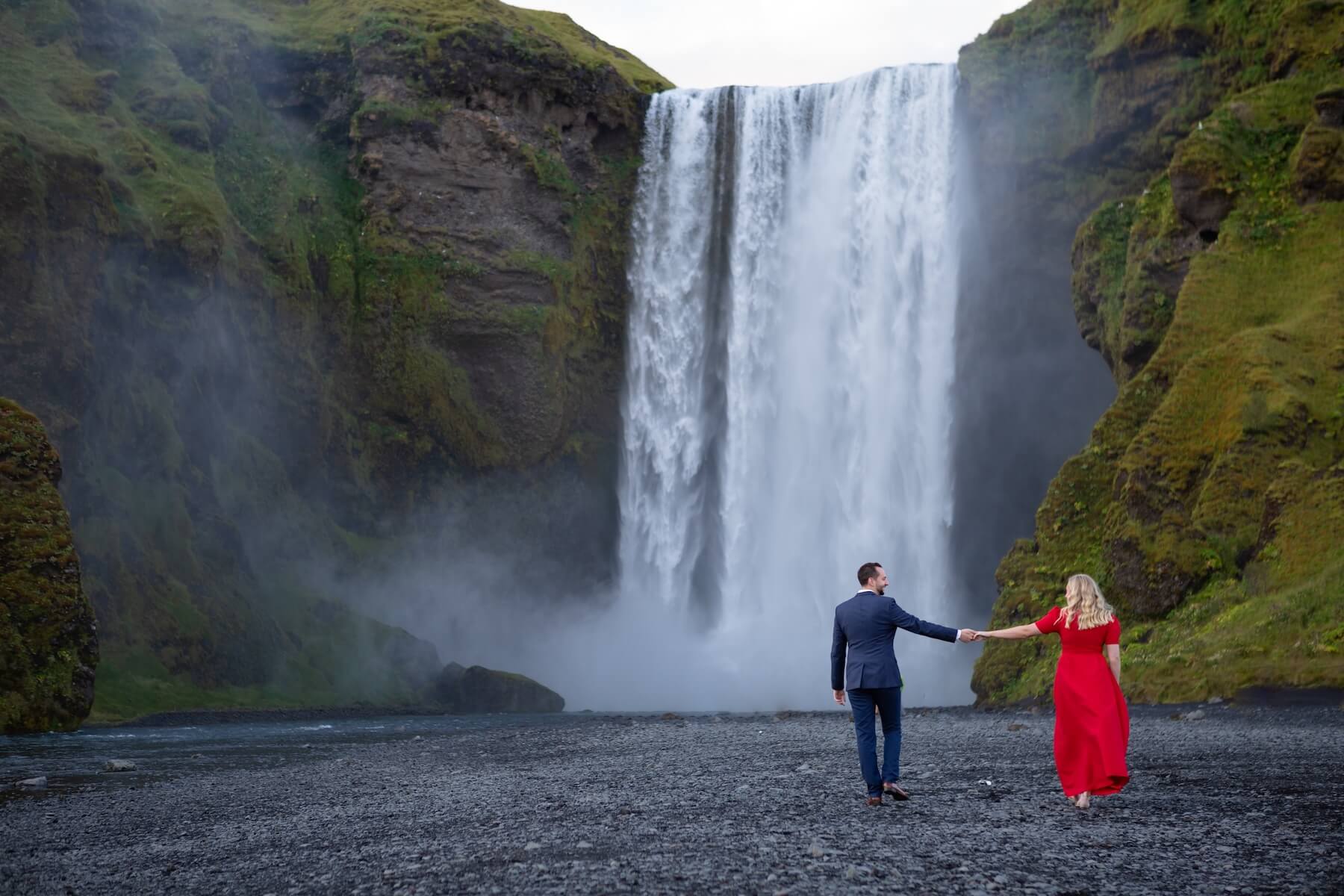 couple walking on a hill in Reykjavik , Iceland