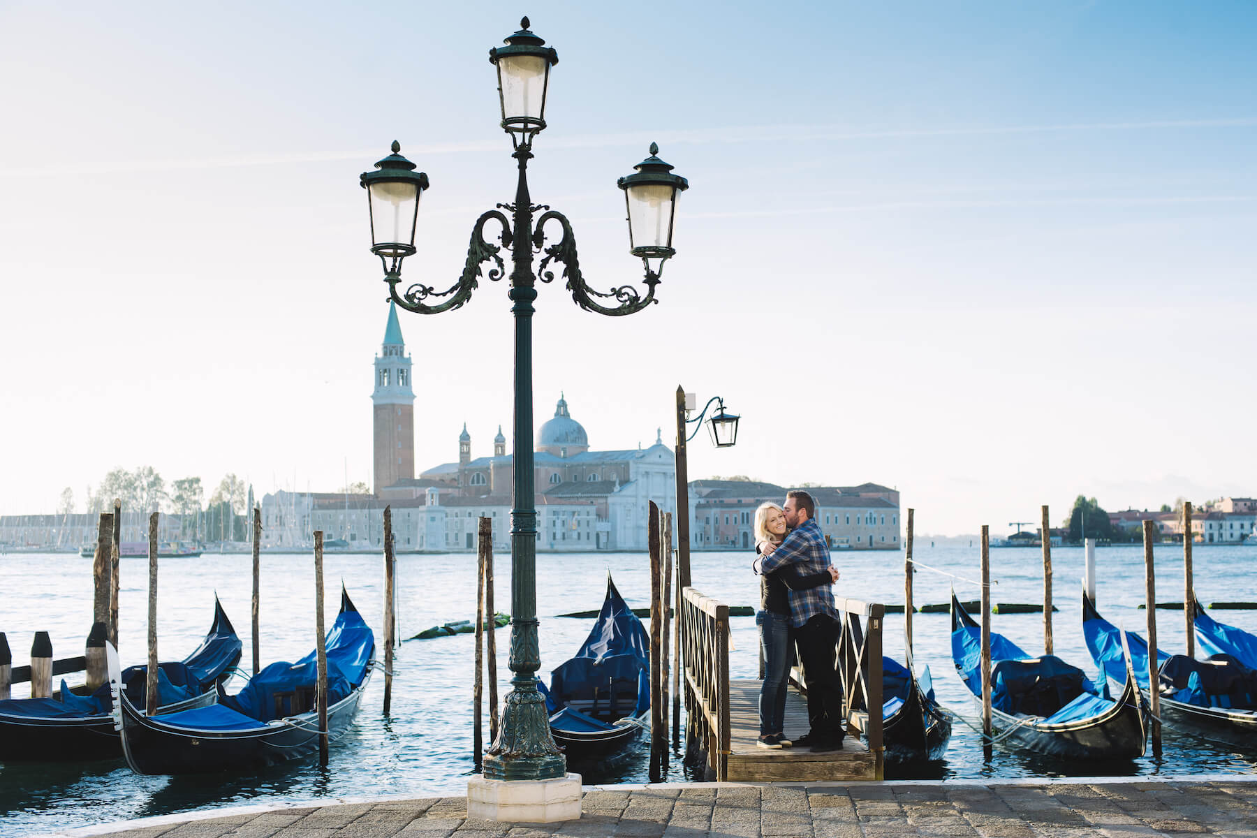 Couple in front of a gondola in Venice Italy