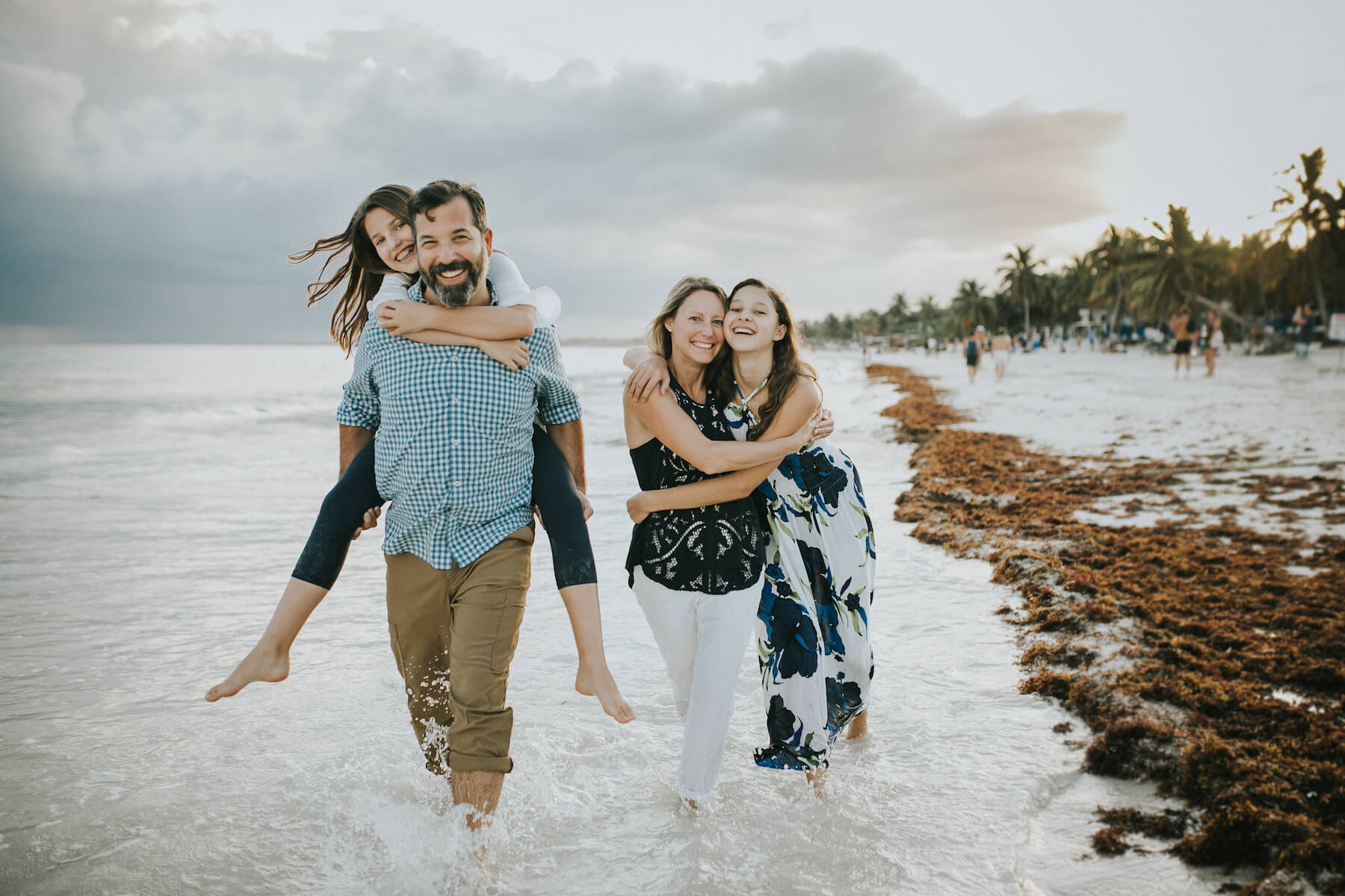 Family in Tulum Mexico laughing with Teenage girls