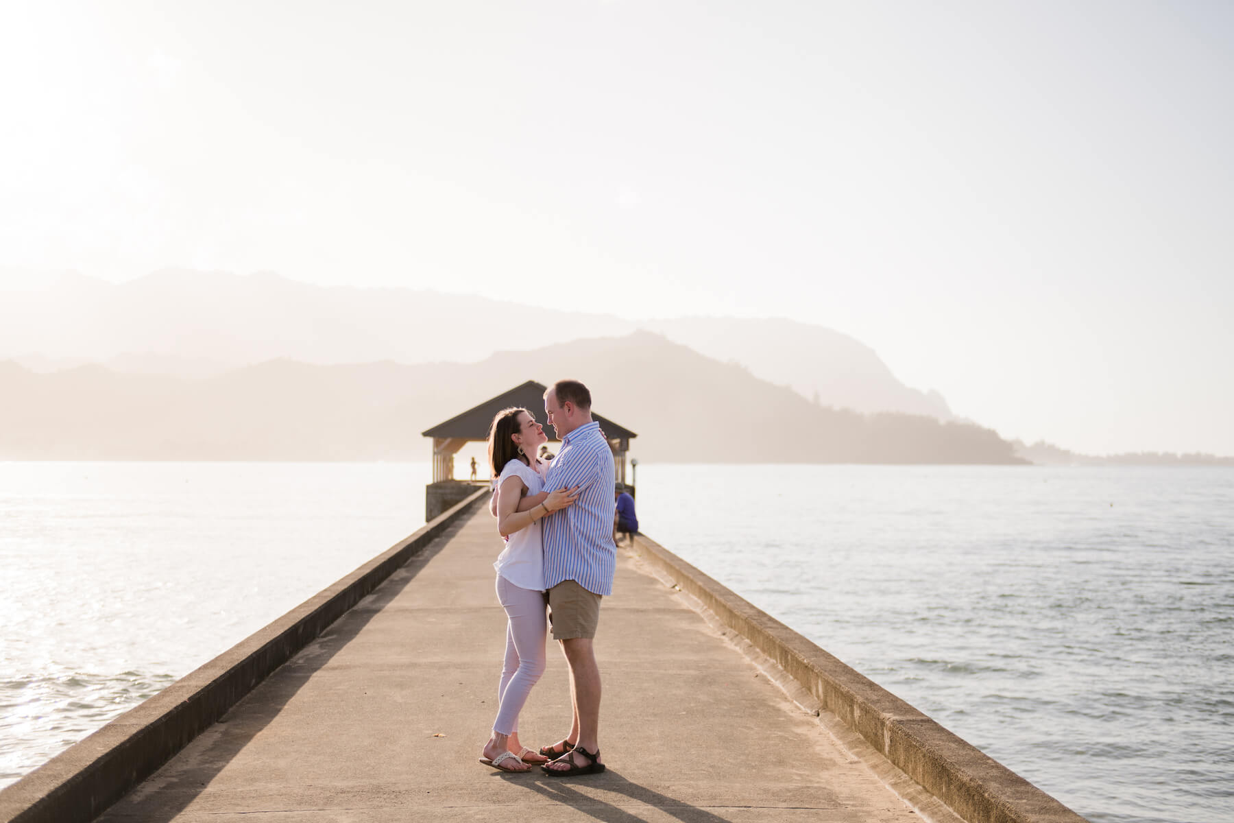 couple on a dock in Kauai Hawaii
