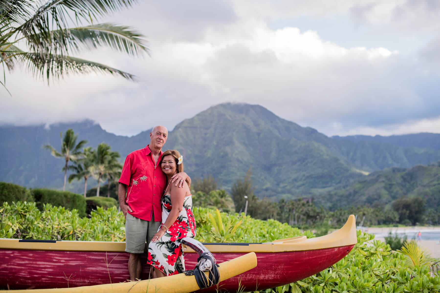 Couple on a beach in Kauai Hawaii experiencing the culture