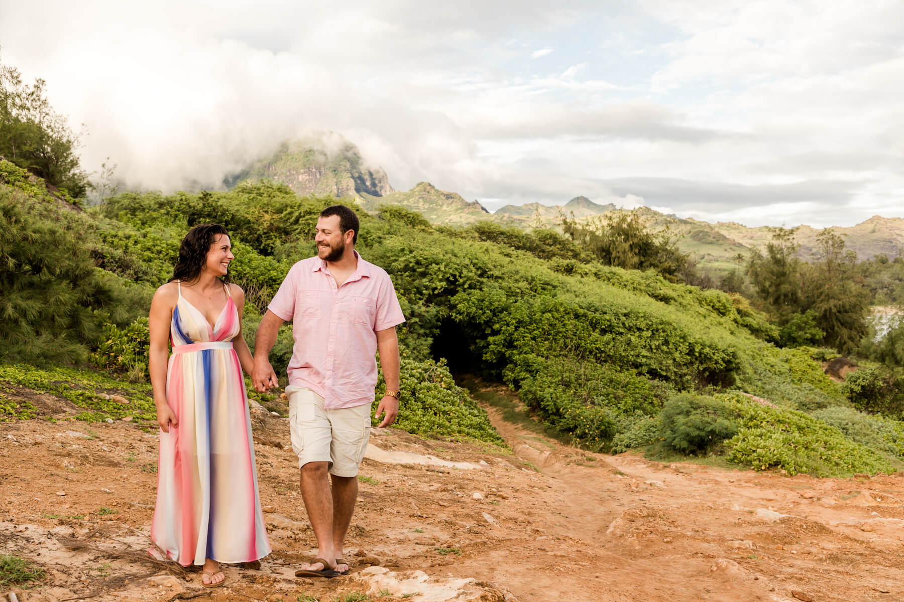 Couple laughing and walking in Kauai Hawaii