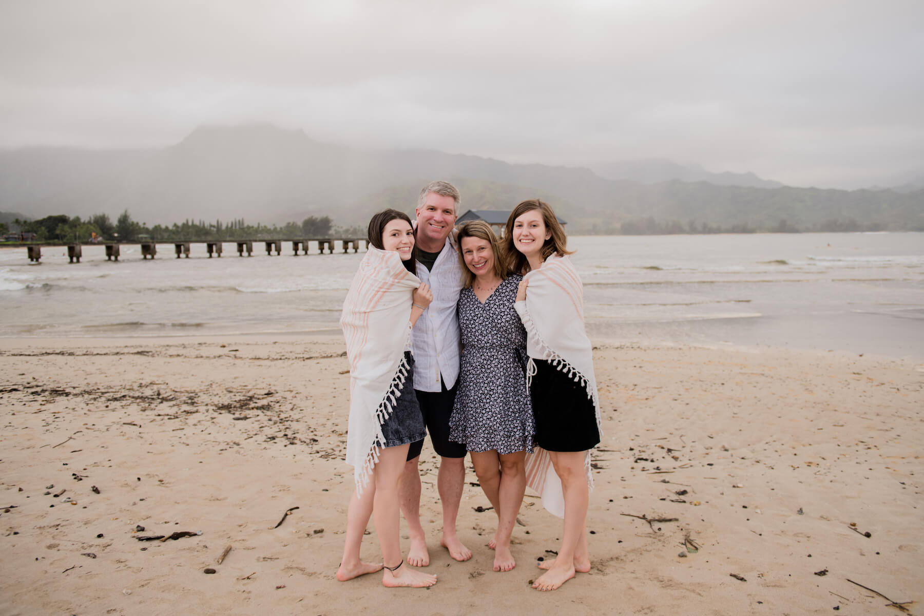 Family on a beach in Kauai Hawaii
