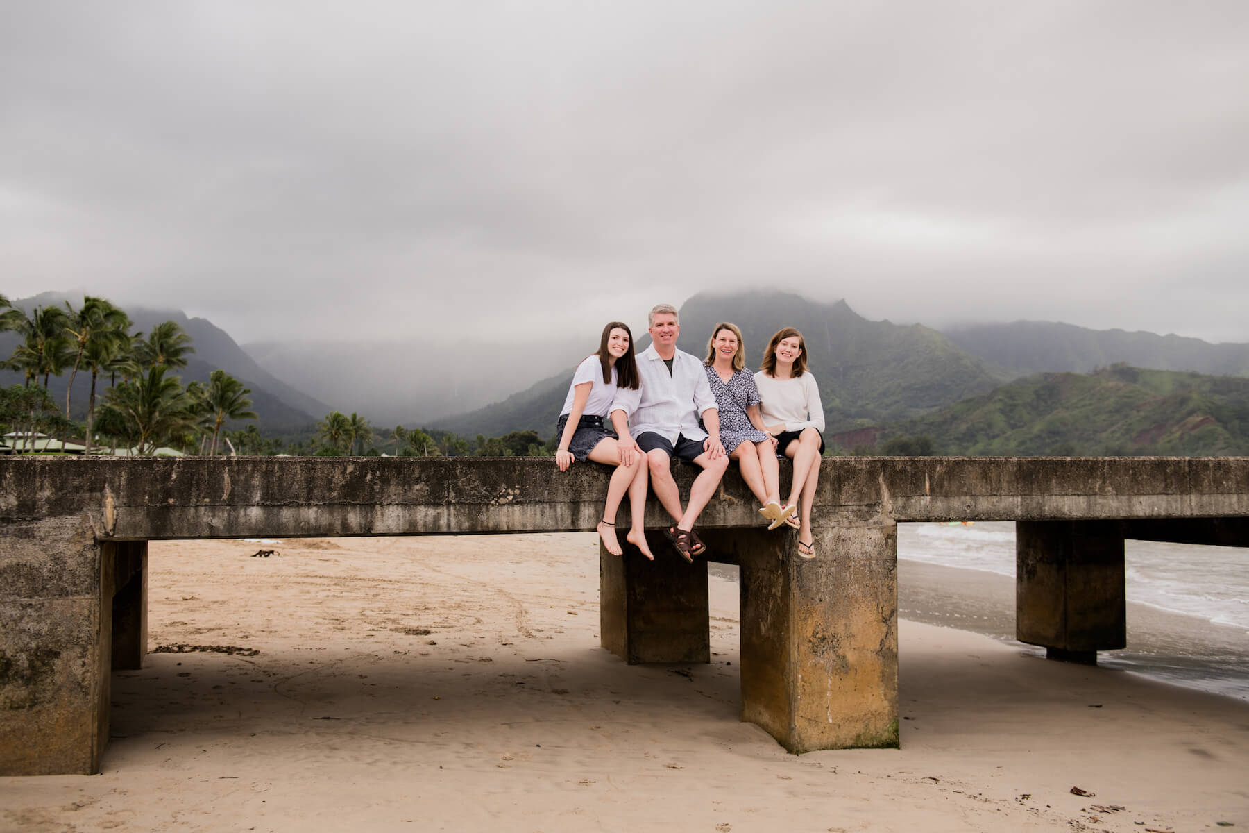 Family on a beach in Kauai Hawaii