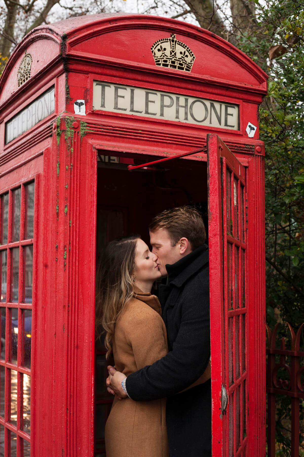 Couple in telephone booth London England