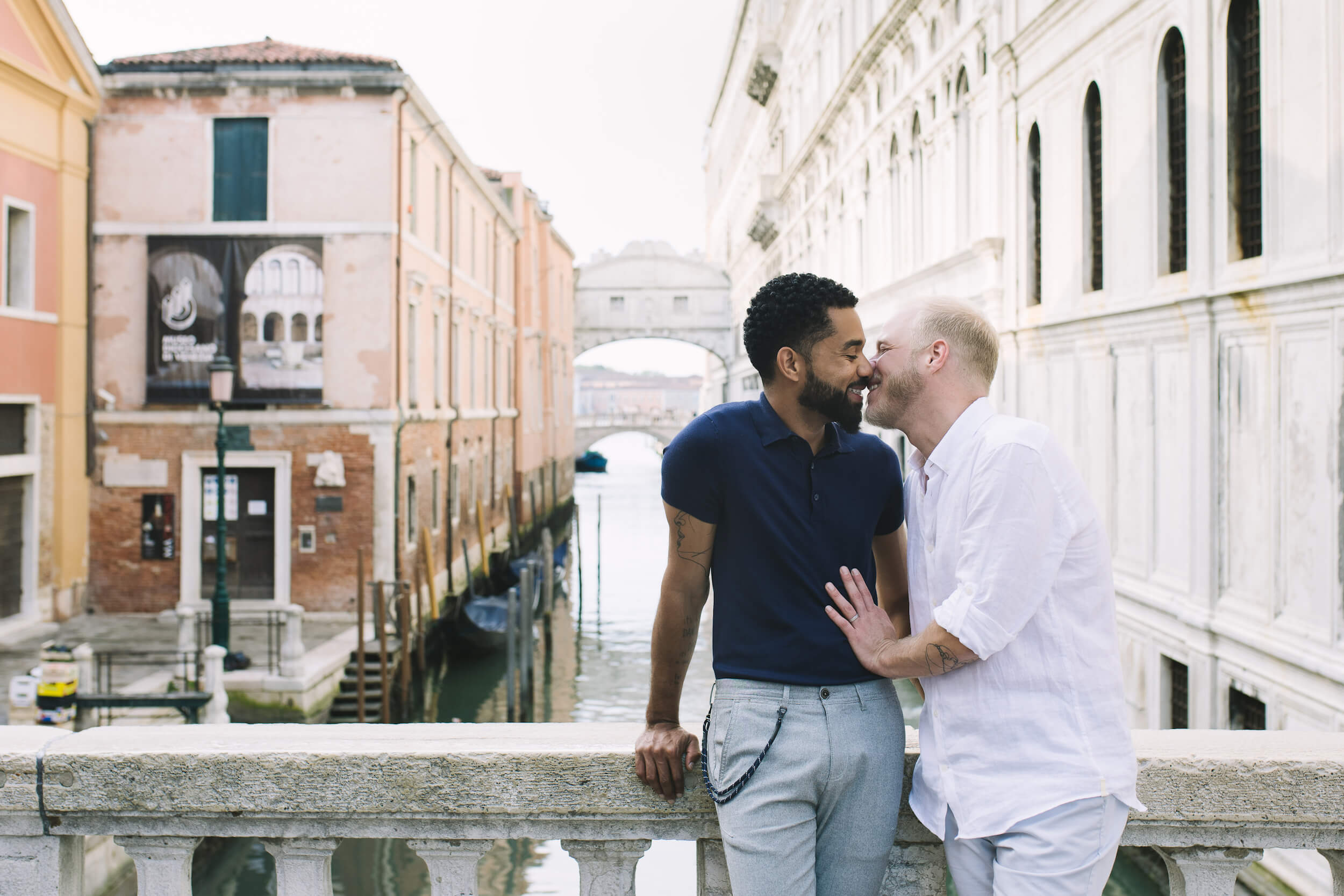 Two men kiss after getting engaged in Venice, Italy.