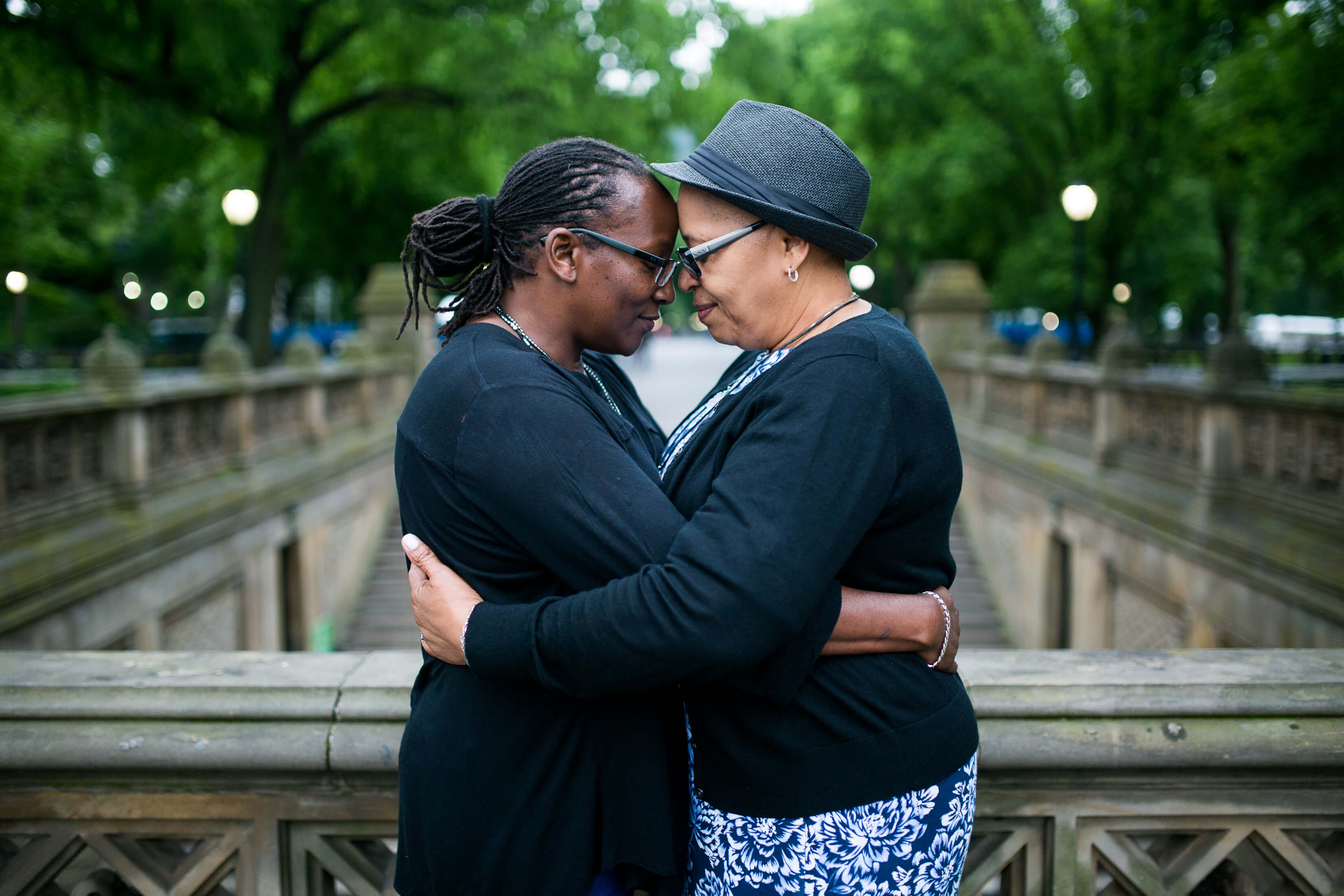Two lovers embrace in Central Park, New York City, USA.