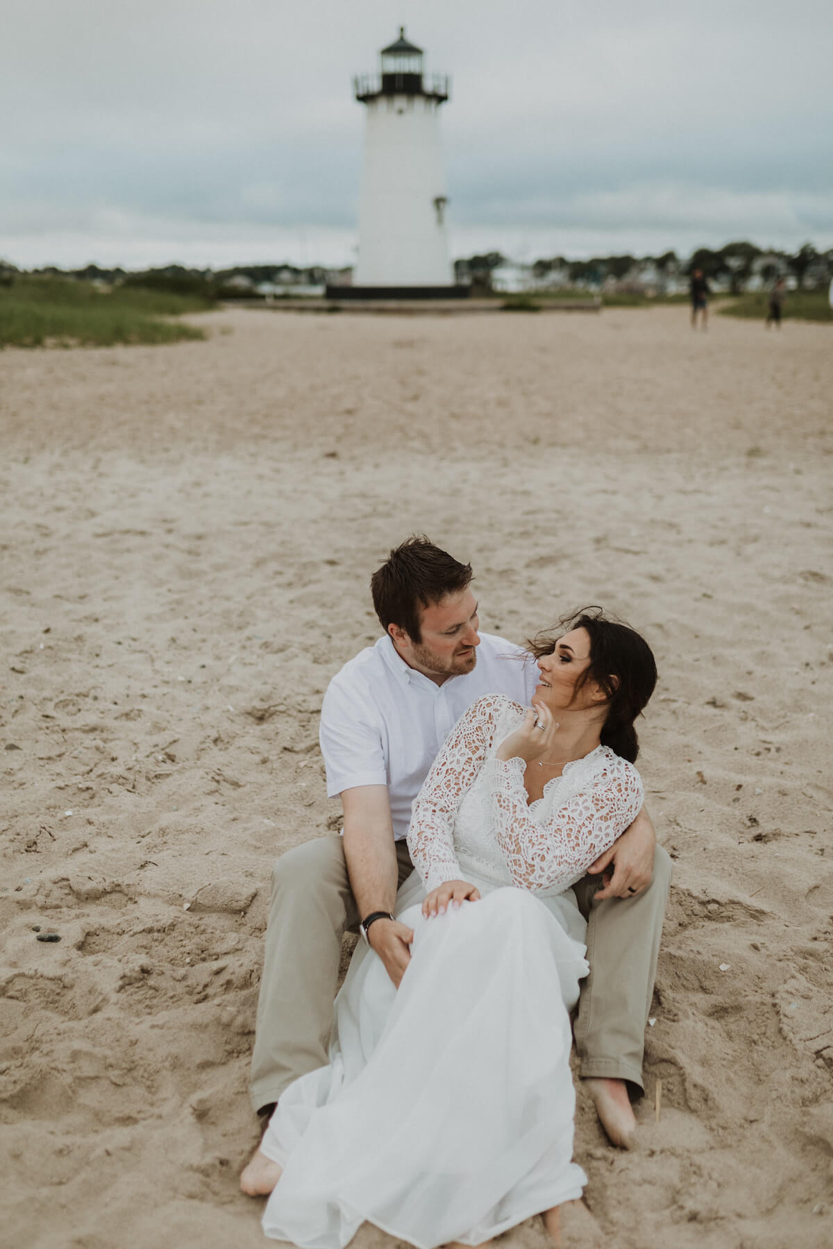 A couple walks along a dock in Martha's Vineyard, Massachusetts, USA.