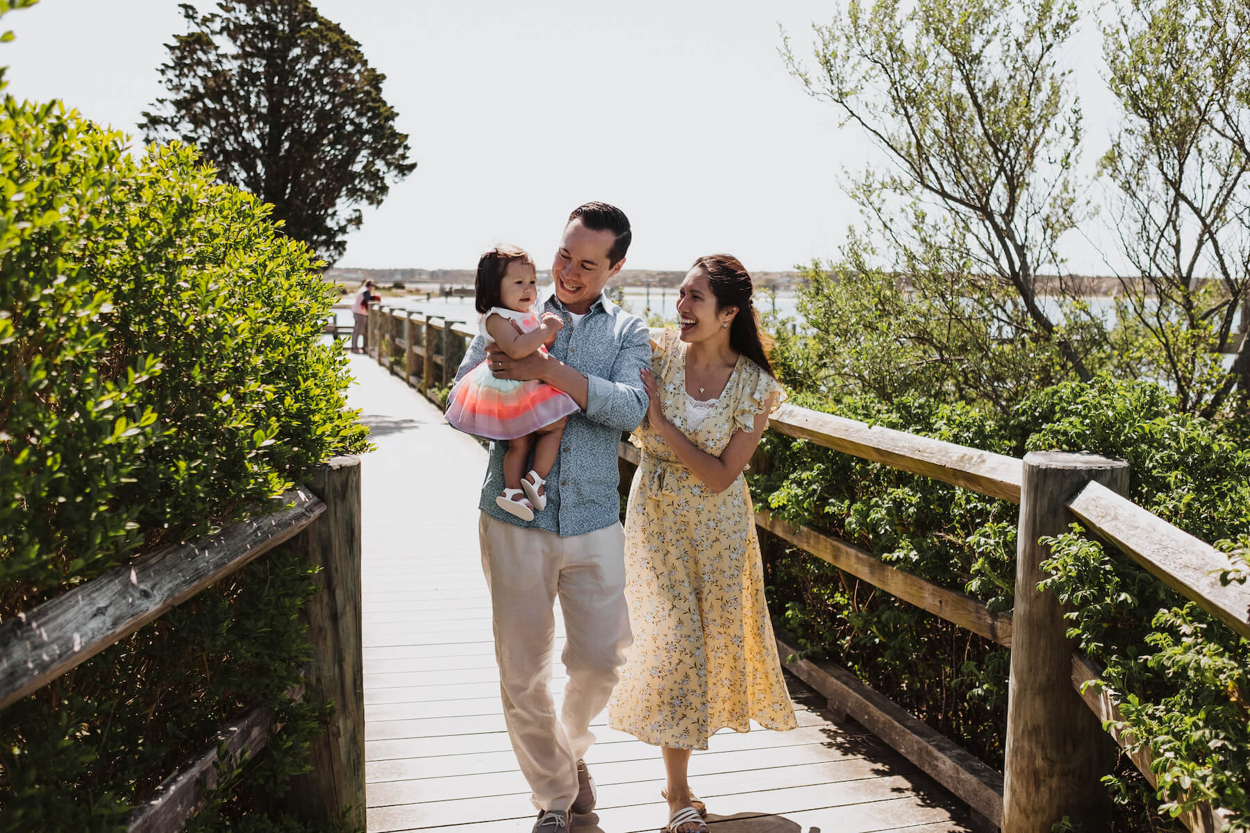 A couple walks along a dock in Martha's Vineyard, Massachusetts, USA.