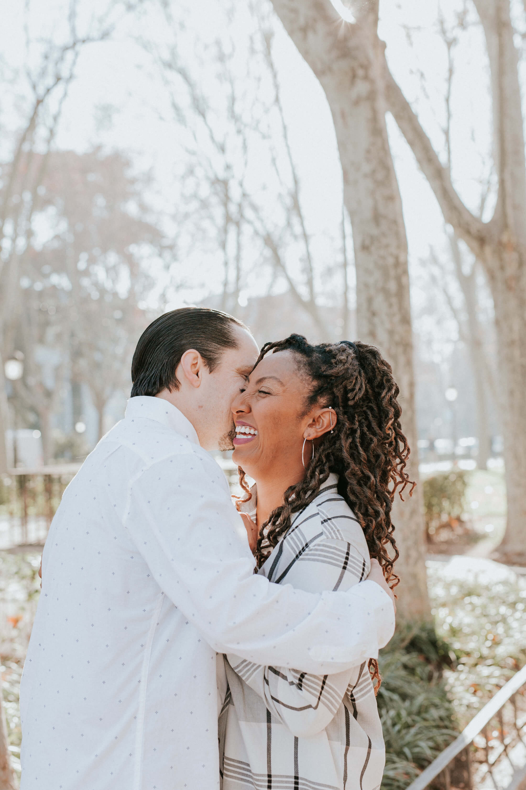 Family of 3 walking down the beach in Ft. Lauderdale, Florida
