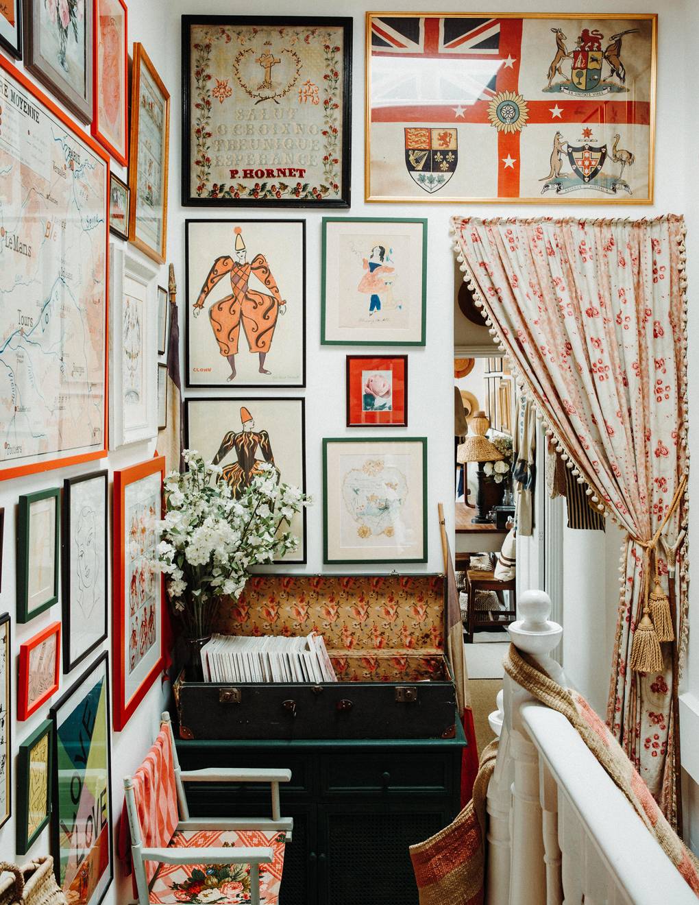 Gallery wall in hallway of house.