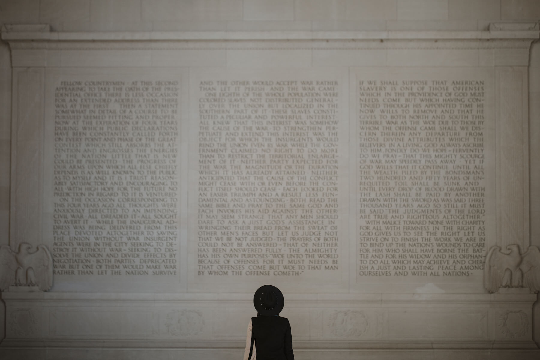 Woman walking at the Lincoln Memorial in Washington DC on a modern headshot photoshoot with Flytographer.