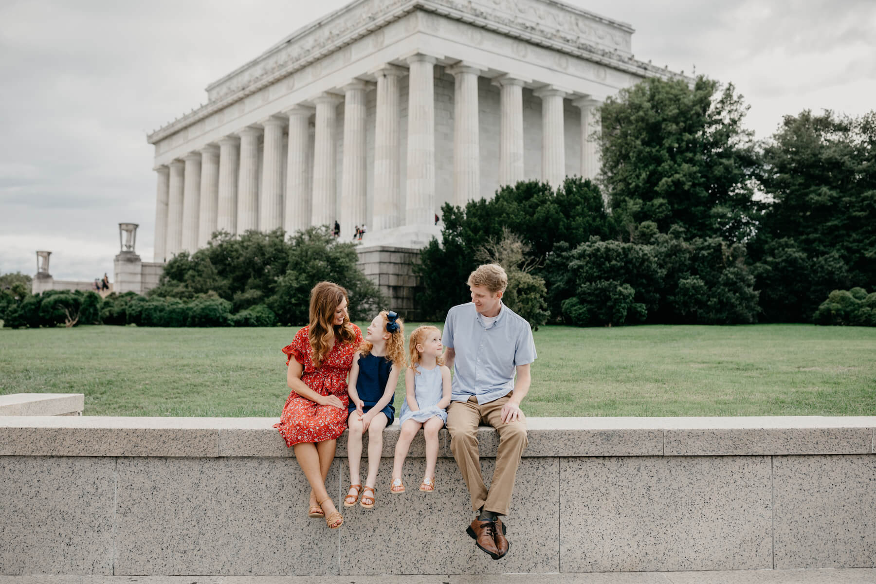 Family walking at the Lincoln Memorial in Washington DC on a family photoshoot with Flytographer.