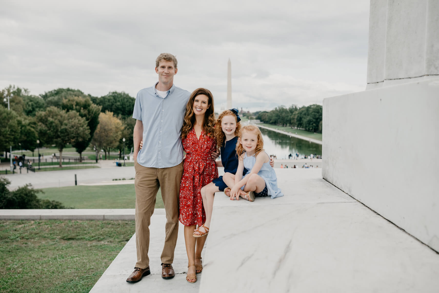 Family walking at the Lincoln Memorial in Washington DC on a family photoshoot with Flytographer.
