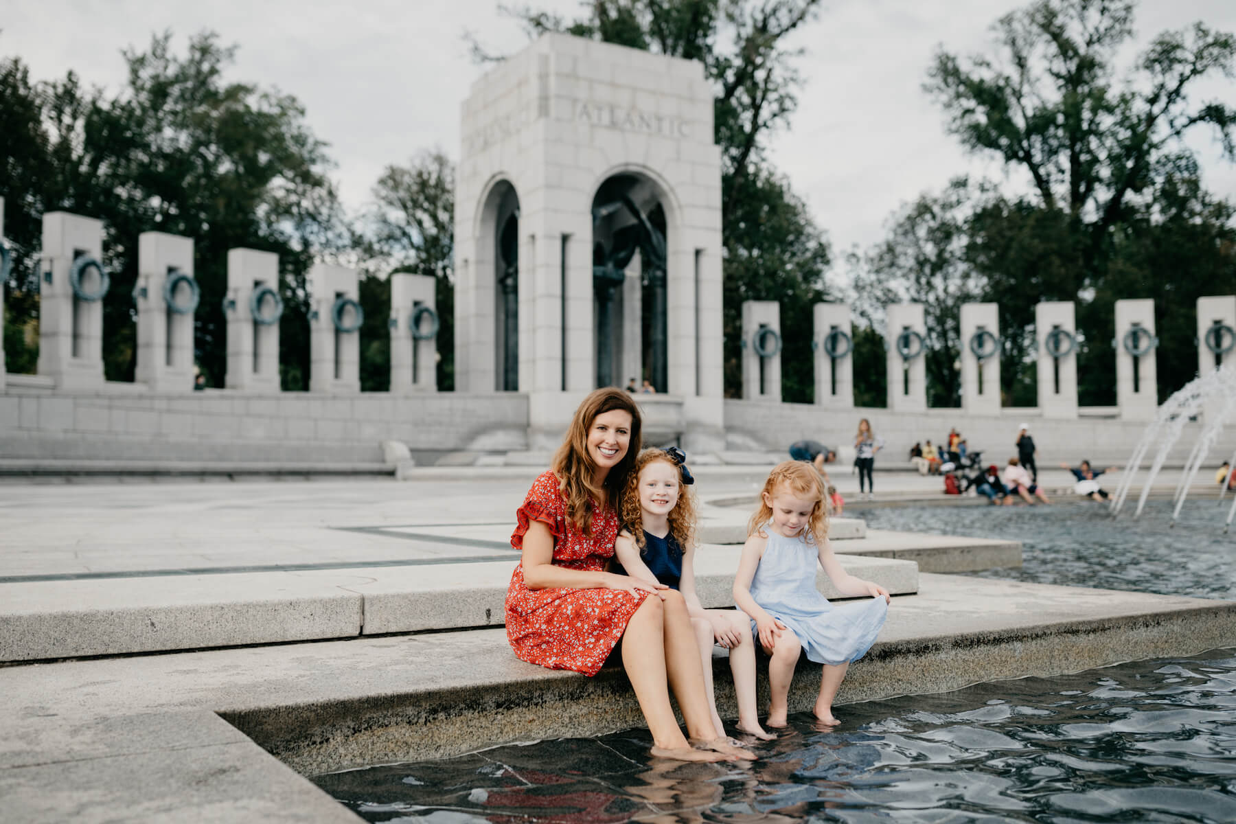 Family walking at the Lincoln Memorial in Washington DC on a family photoshoot with Flytographer.