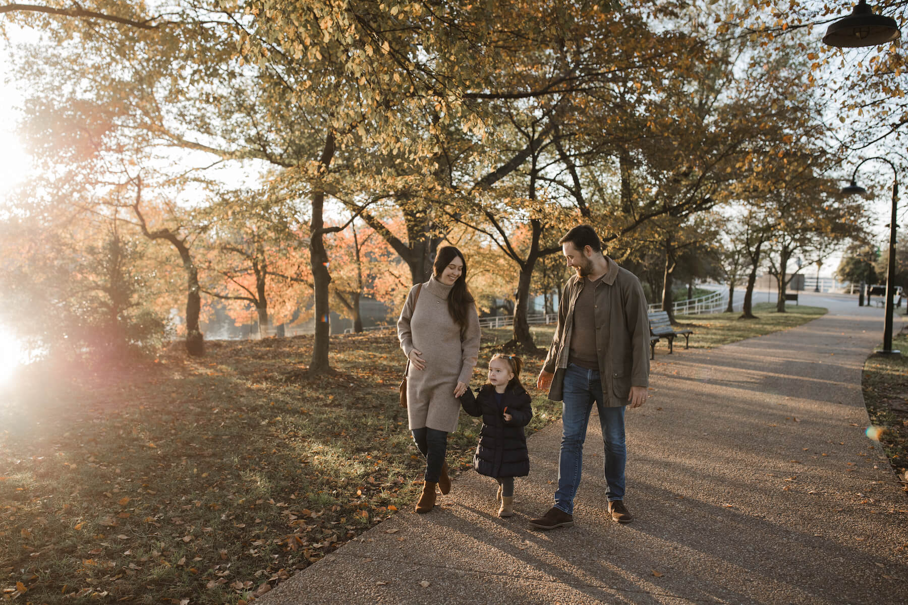 Family posing at the tidal basin in Washington DC on a family photoshoot with Flytographer.