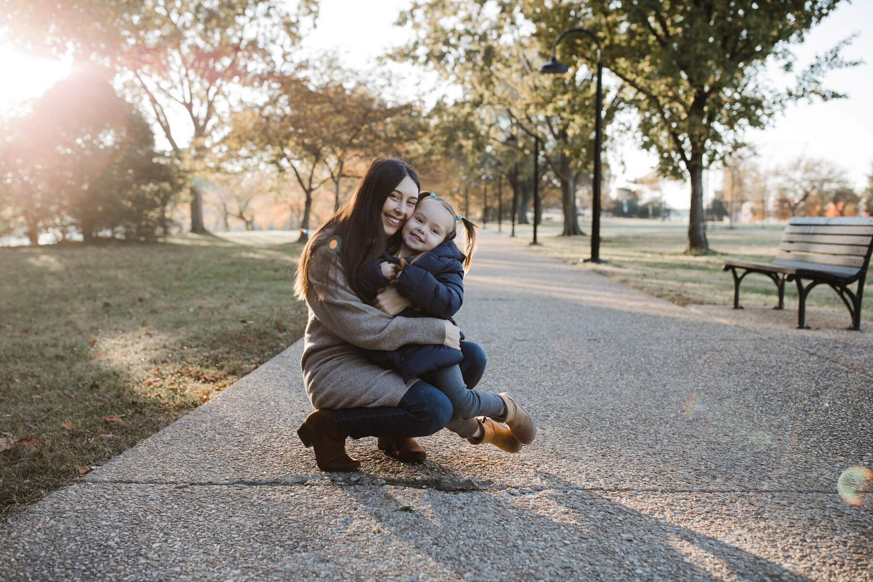 Family posing at the tidal basin in Washington DC on a family photoshoot with Flytographer.