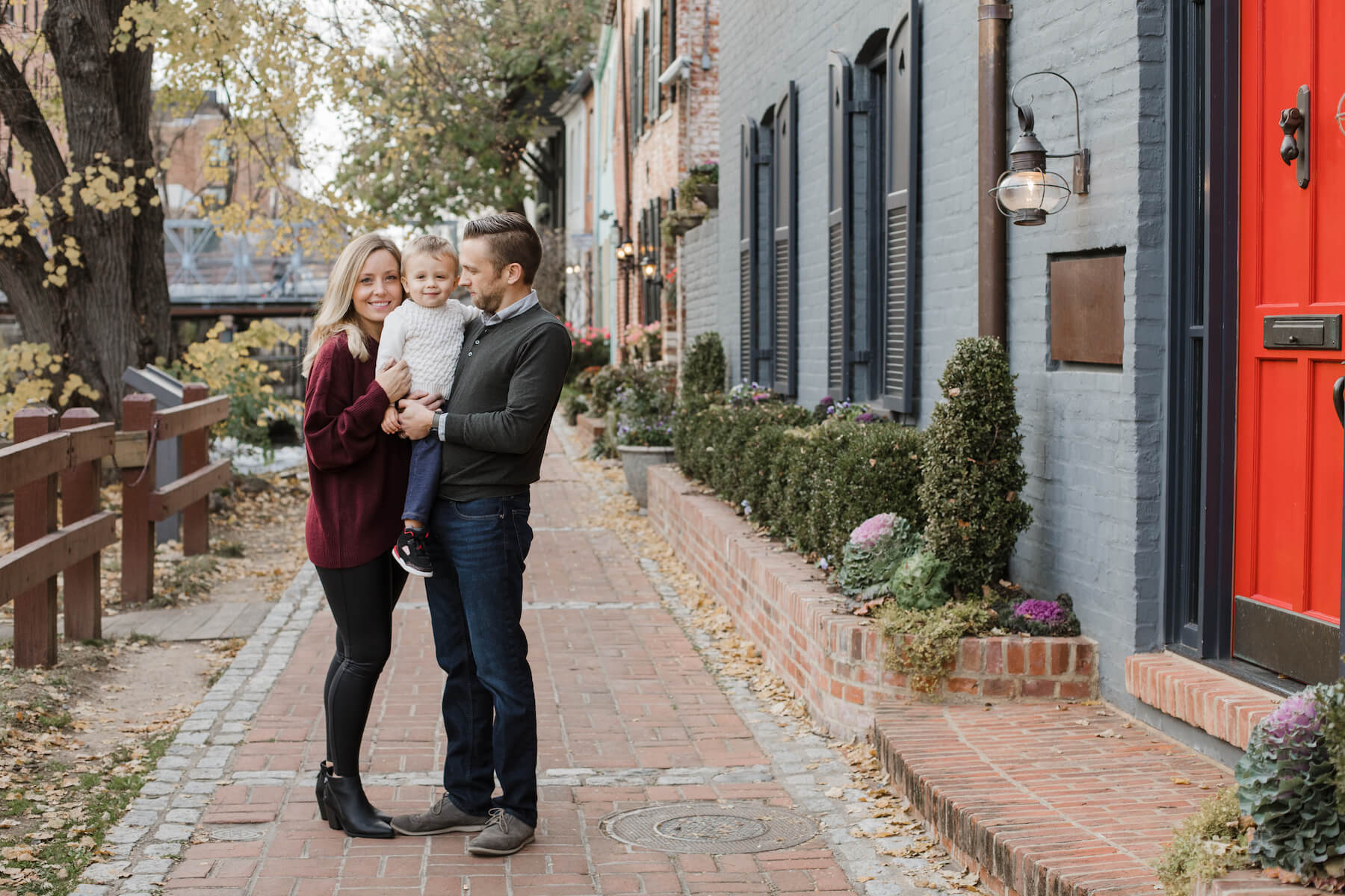 Family posing at the canal Washington DC on a family photoshoot with Flytographer.