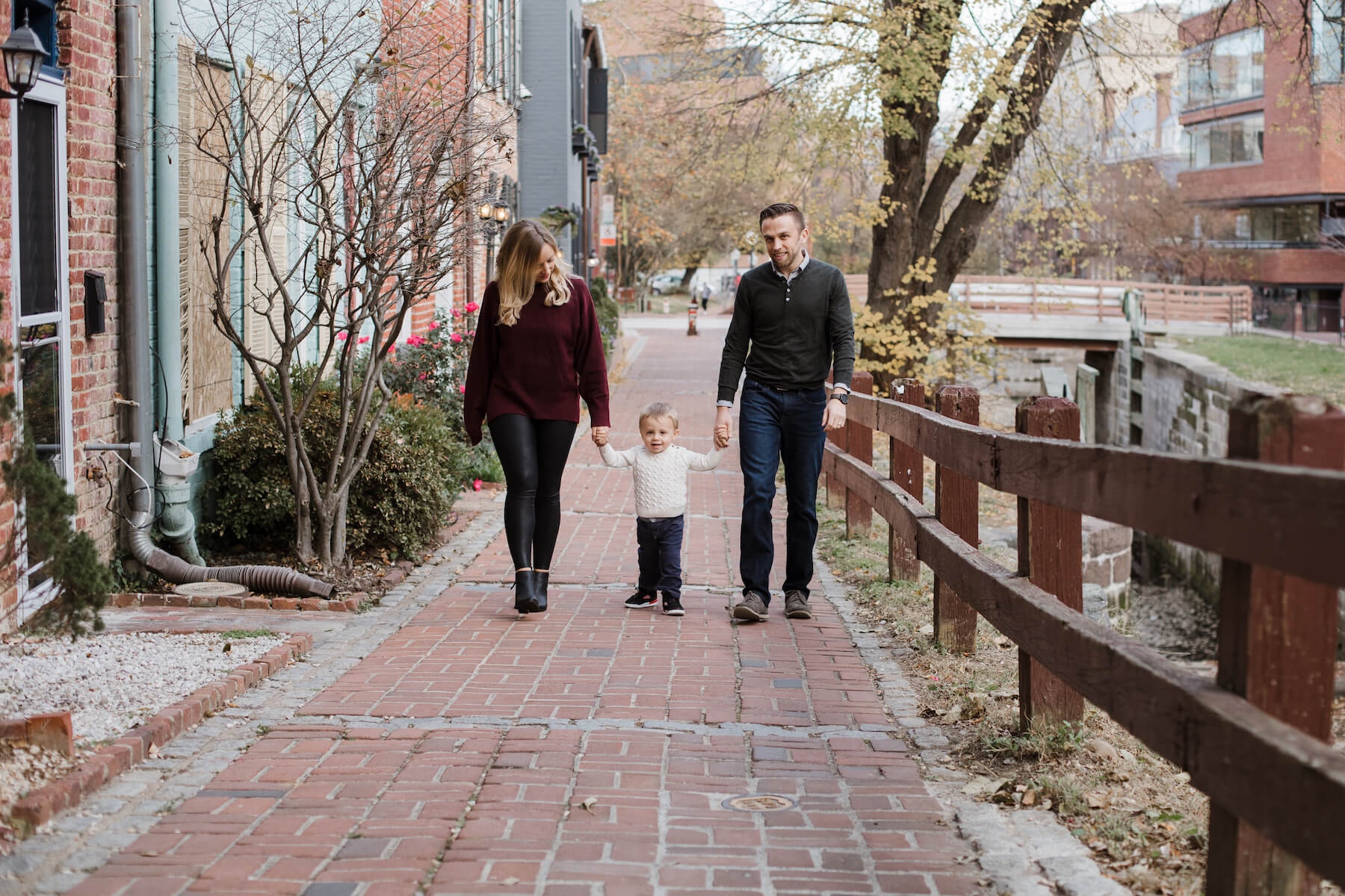 Family posing at the canal Washington DC on a family photoshoot with Flytographer.