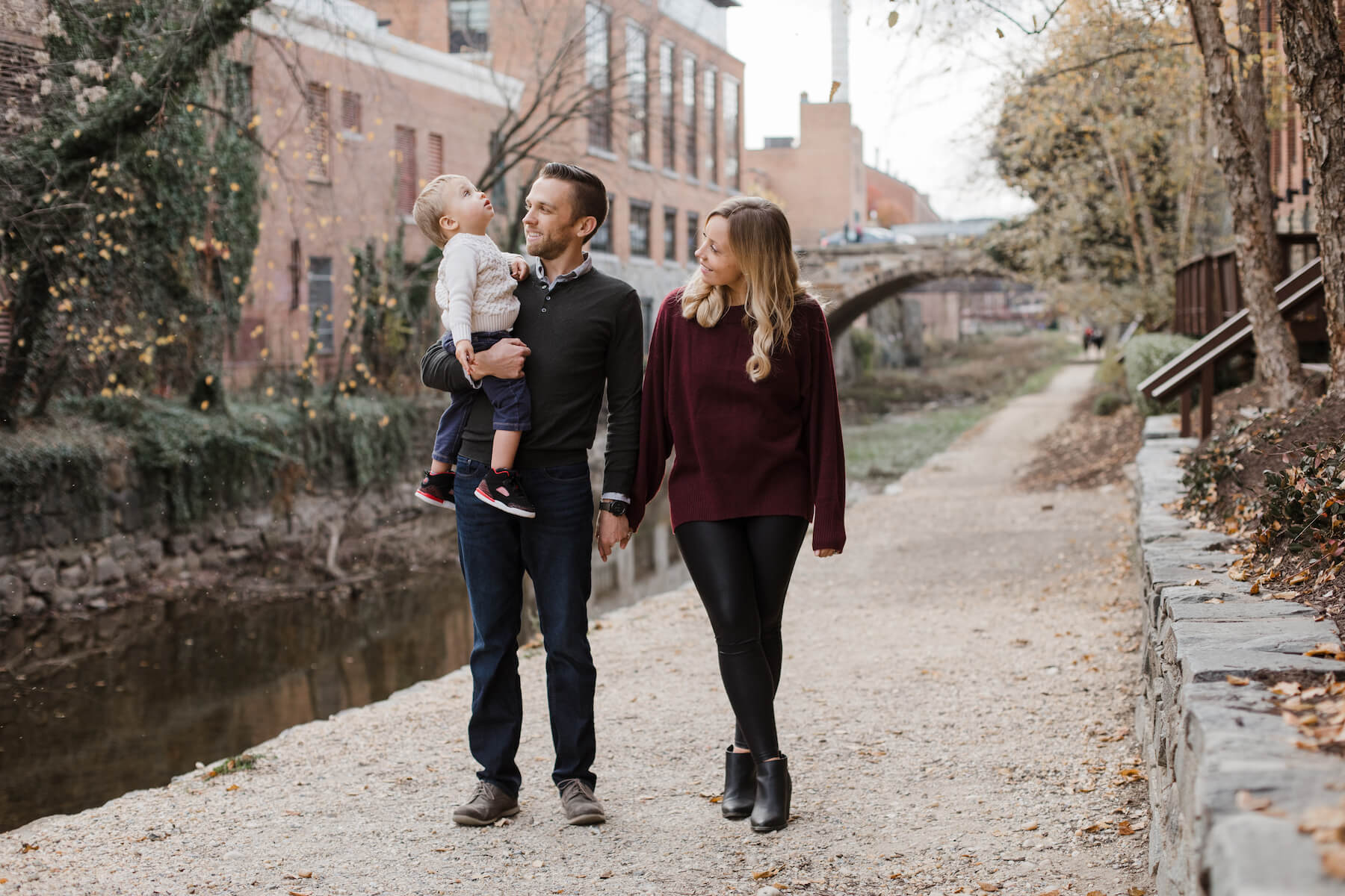 Family posing at the canal Washington DC on a family photoshoot with Flytographer.