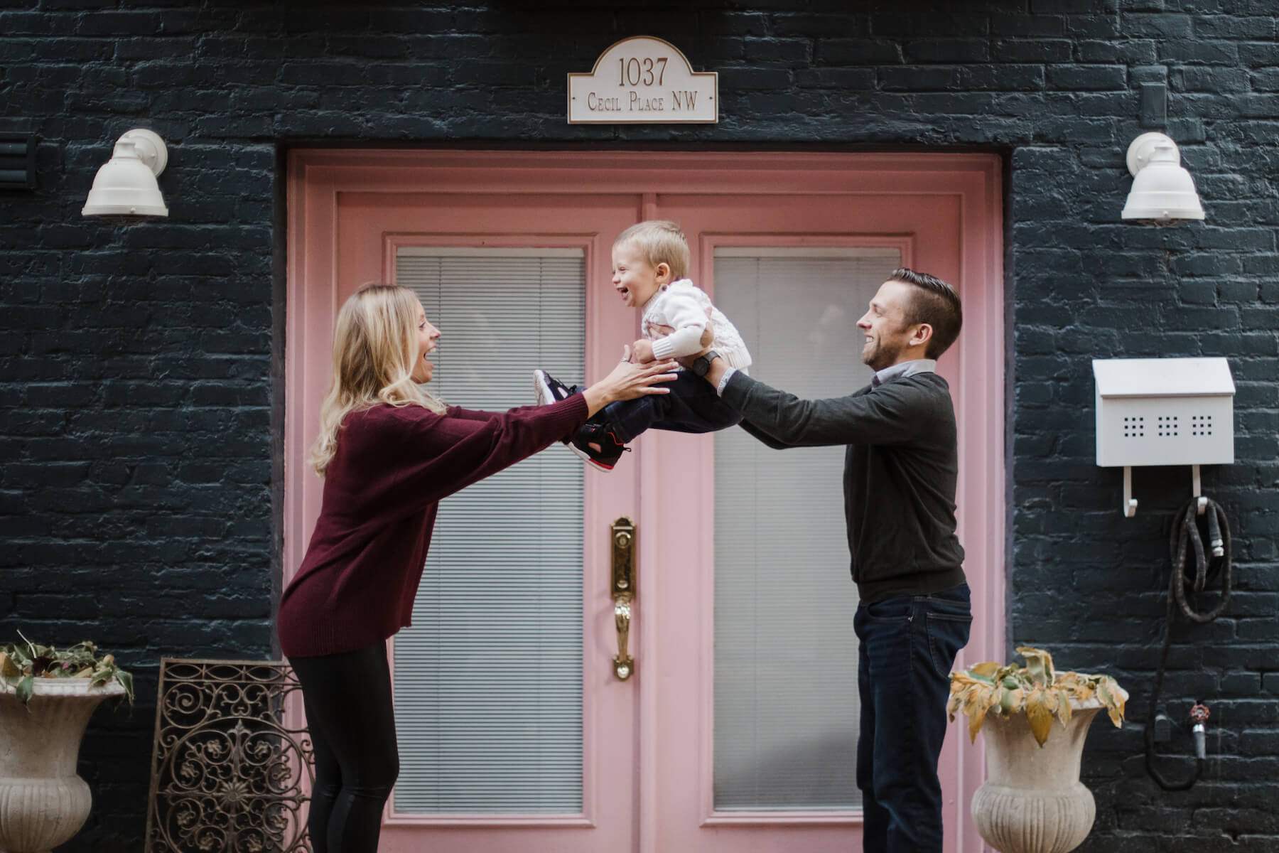 Family posing at the canal Washington DC on a family photoshoot with Flytographer.
