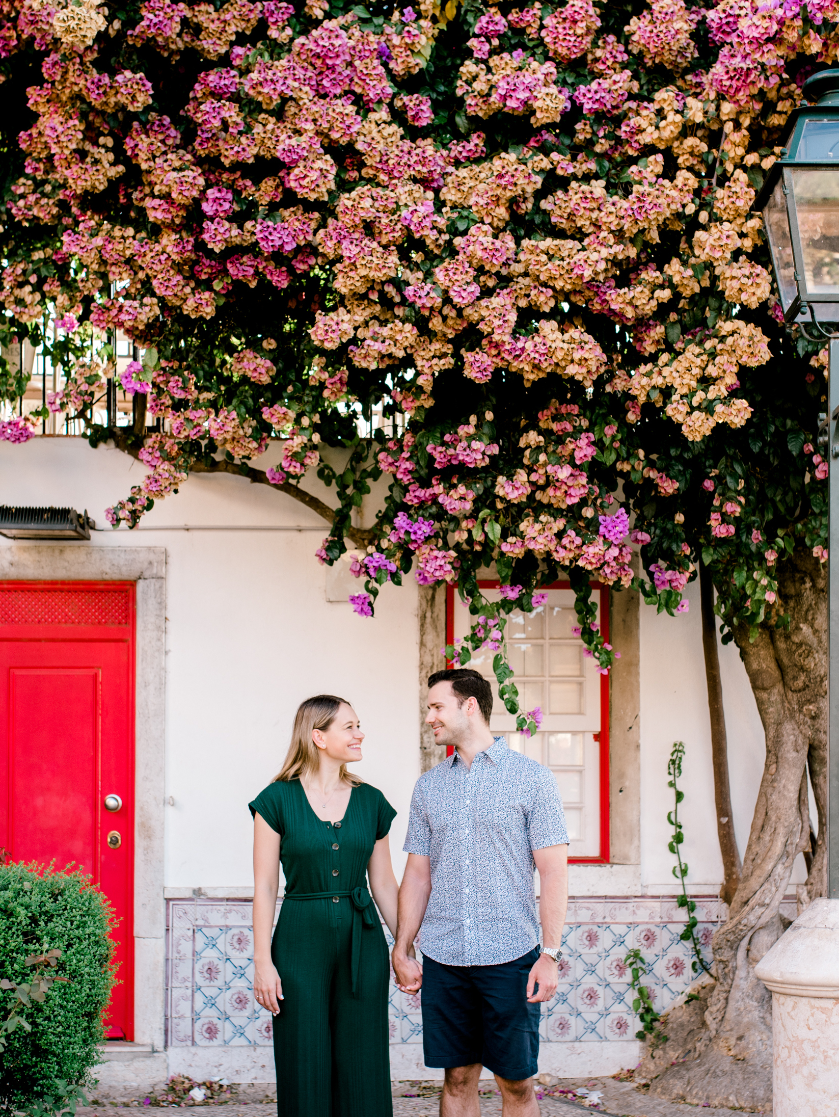 a couple looking at each other on a couple photoshoot in Lisbon, Portugal with Flytographer
