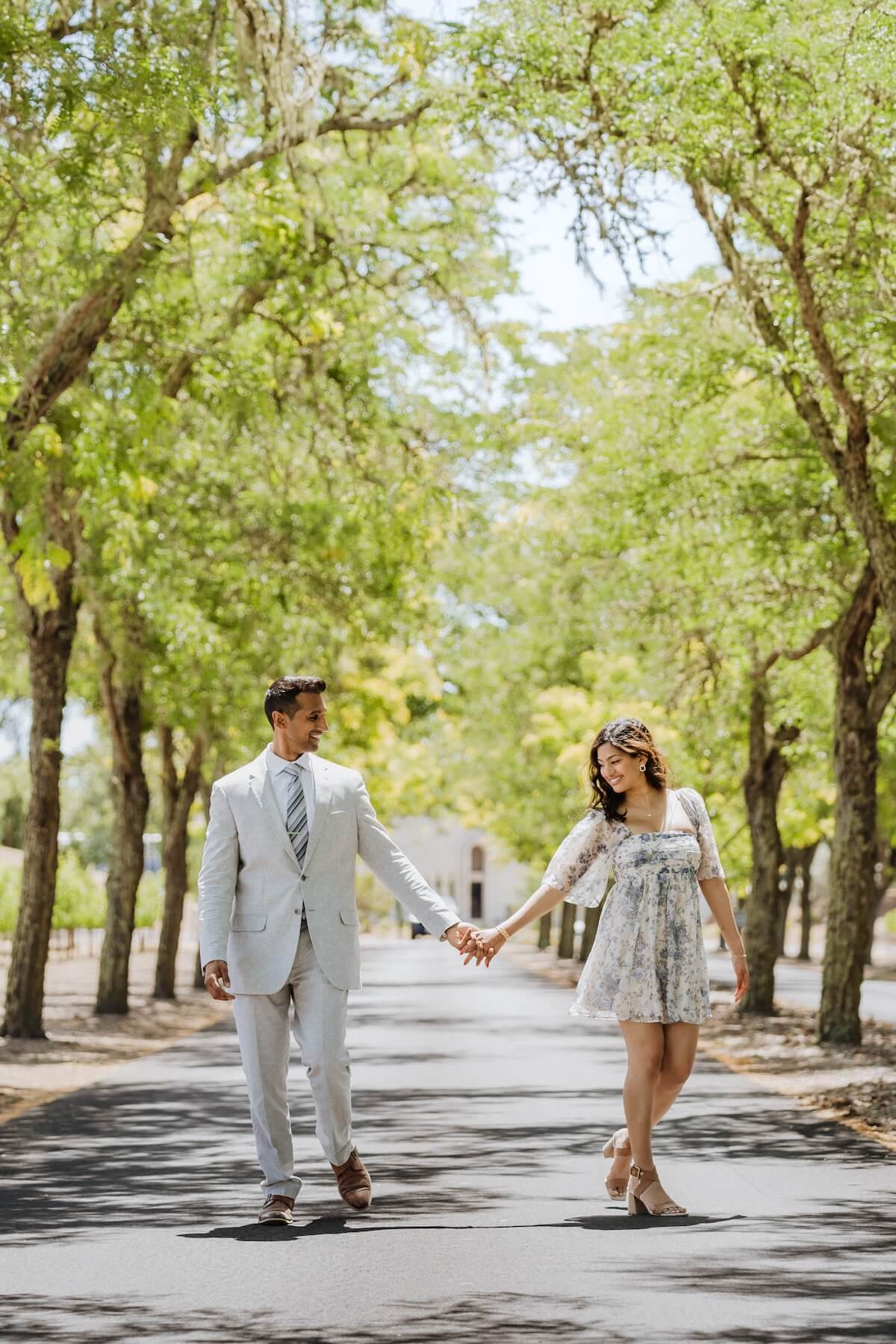 Woman wearing a red dress is being proposed to on a doc in Mauritius
