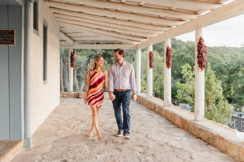 A couple walking in their hotel in Santa Fe on a couples photoshoot with Flytographer.