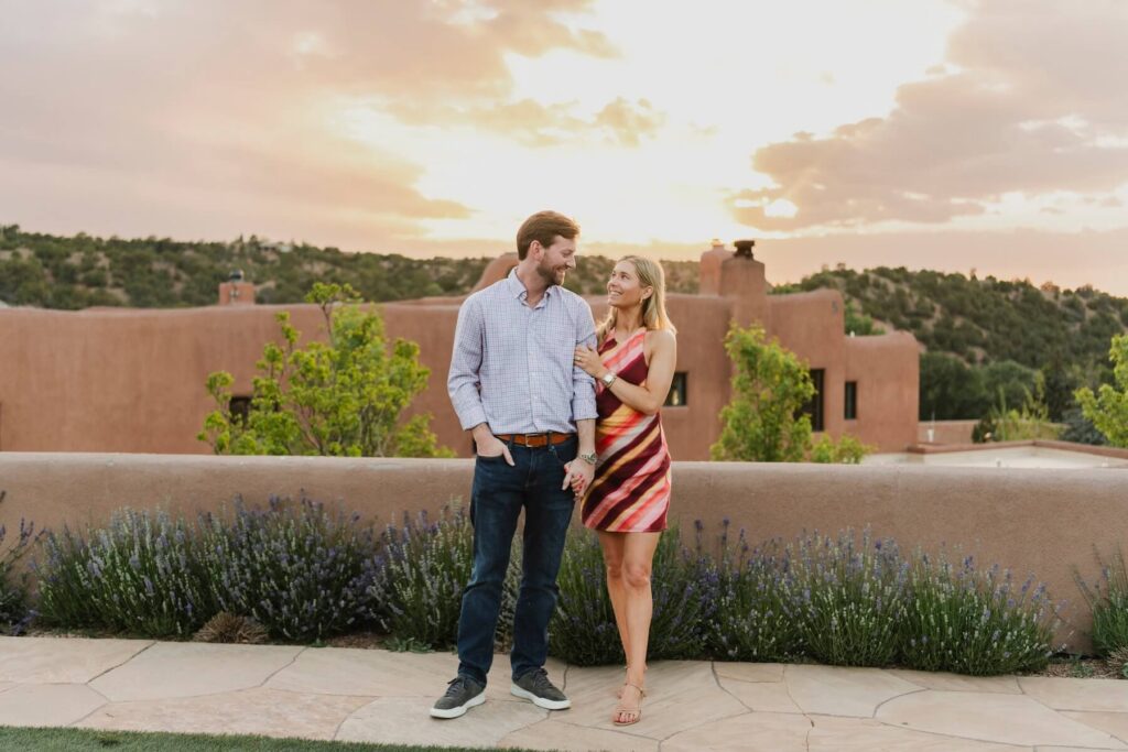 A couple walking in their hotel in Santa Fe on a couples photoshoot with Flytographer.