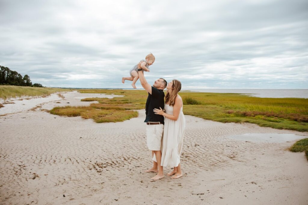 Family playing on the beach in Cape Cod on a family photoshoot with Flytographer.