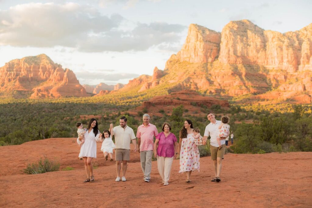 A family walking in Bell Rock Vortex in Sedona on a family photoshoot with Flytographer.