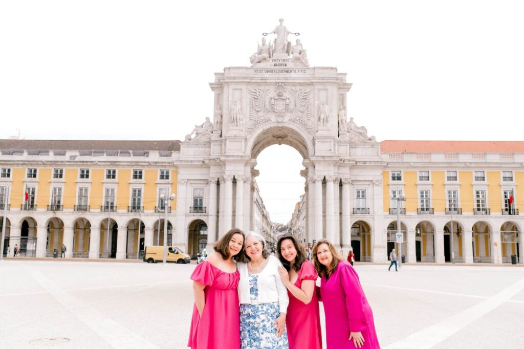 Friends posing for a picture in Lisbon, Portugal on a friends photoshoot with Flytographer.