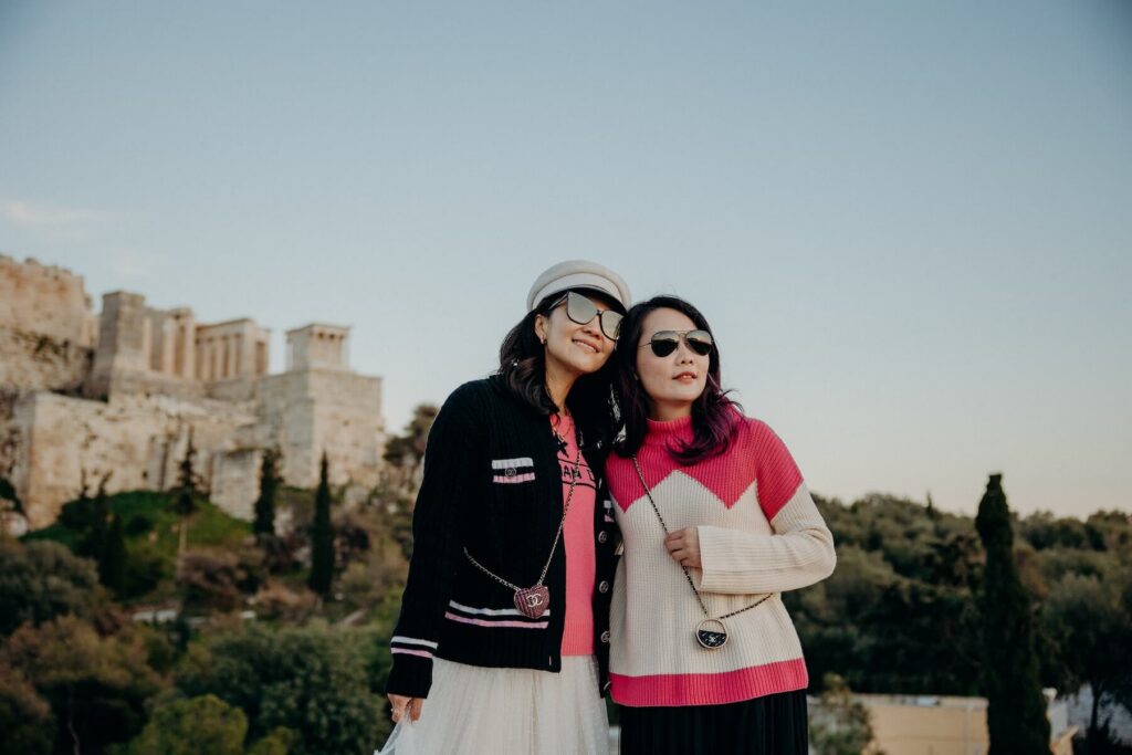 Friends posing for a photo together in Athens on a friends photoshoot with Flytographer.