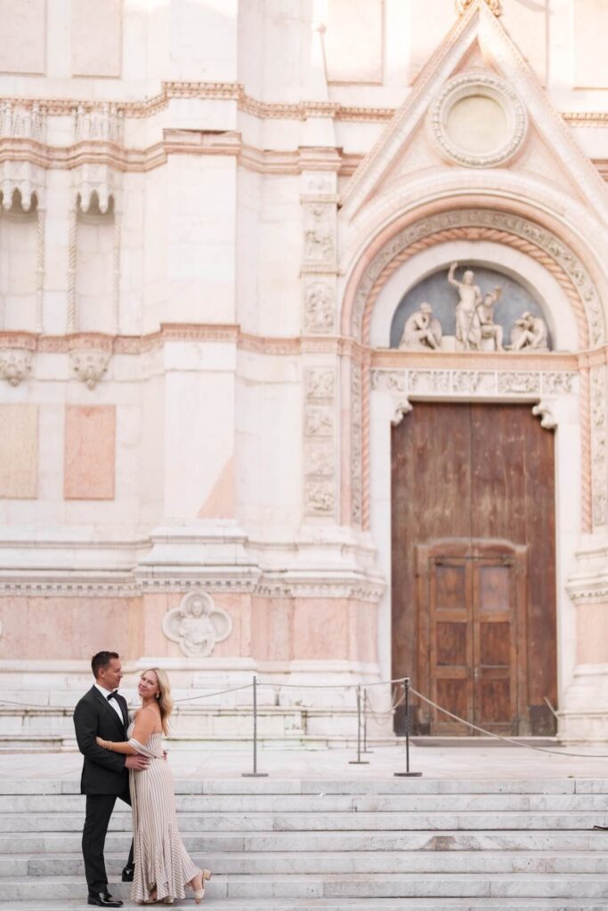 A couple walking in Bologna, which is one of the best places to visit in Italy, on a couples photoshoot with Flytographer.