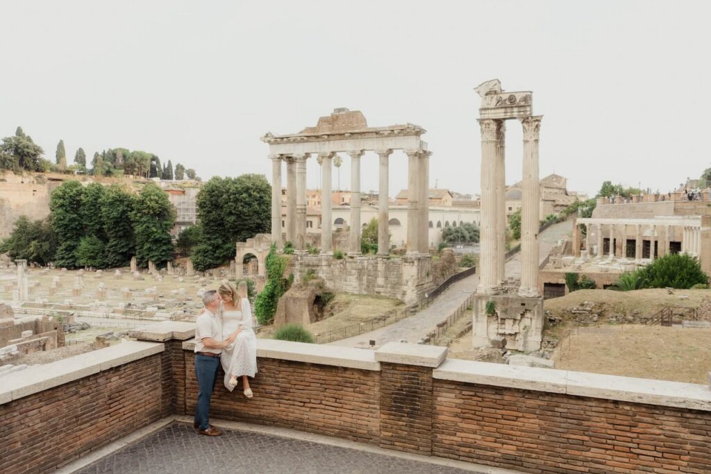 A couple walking in Rome, which is one of the best places to visit in Italy, on a couples photoshoot with Flytographer.