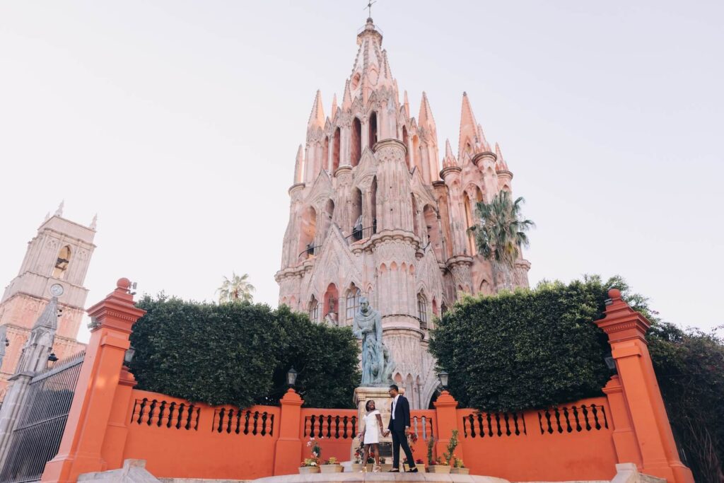 A couple walking near the church in San Miguel de Allende, Mexico, one of the most European cities in North America on a photoshoot with Flytographer