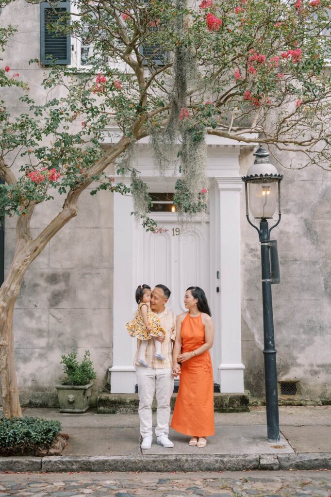 A family hugging in Charleston, South Carolina, one of the most European cities in North America on a photoshoot with Flytographer