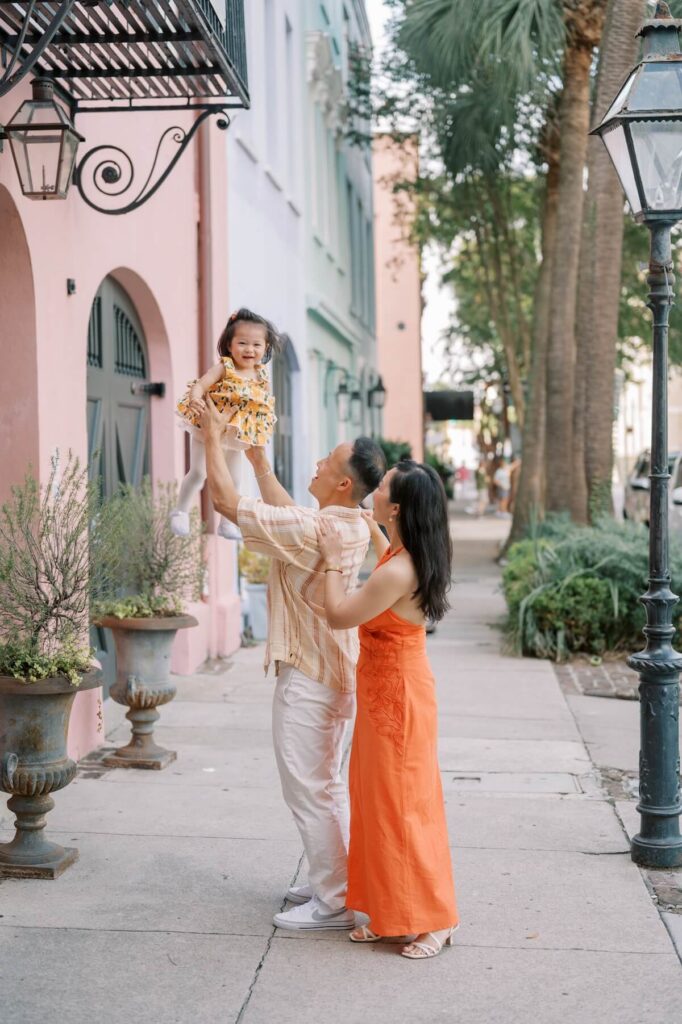 A family hugging in Charleston, South Carolina, one of the most European cities in North America on a photoshoot with Flytographer